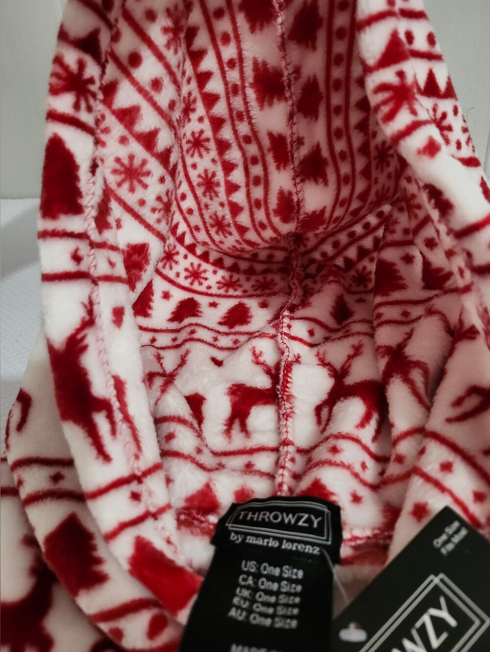 Throwzy wearable blanket hoodie features a red and white reindeer holiday patter - Picture 6 of 12
